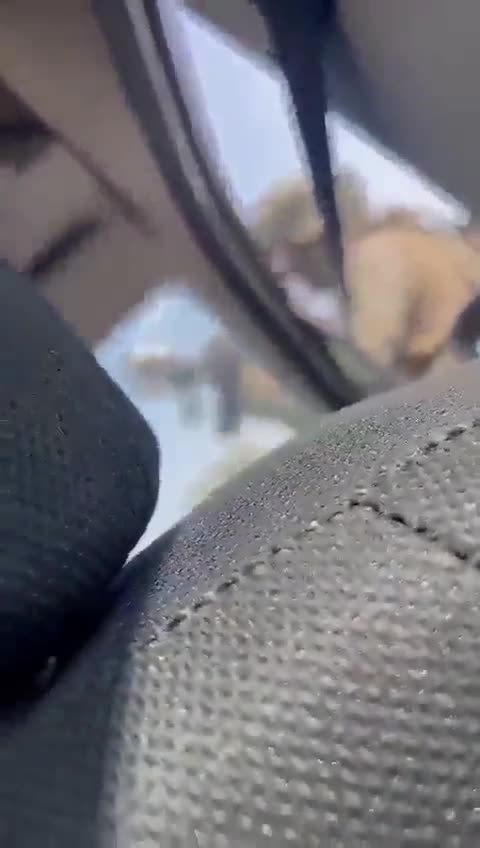 Isreali soldiers take cover near civilians during Hamas attack