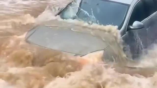 Vehicles passing through the stagnant water area