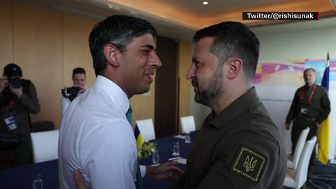 UK Prime Minister Sunak embraces Ukrainian President Zelensky at G7 summit