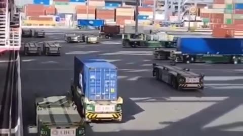 Robot trailers crabwalk at port