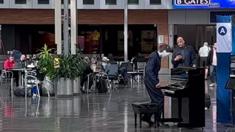 Michael Myers interrupted by Cat Woman at the airport. Shocked crowd!