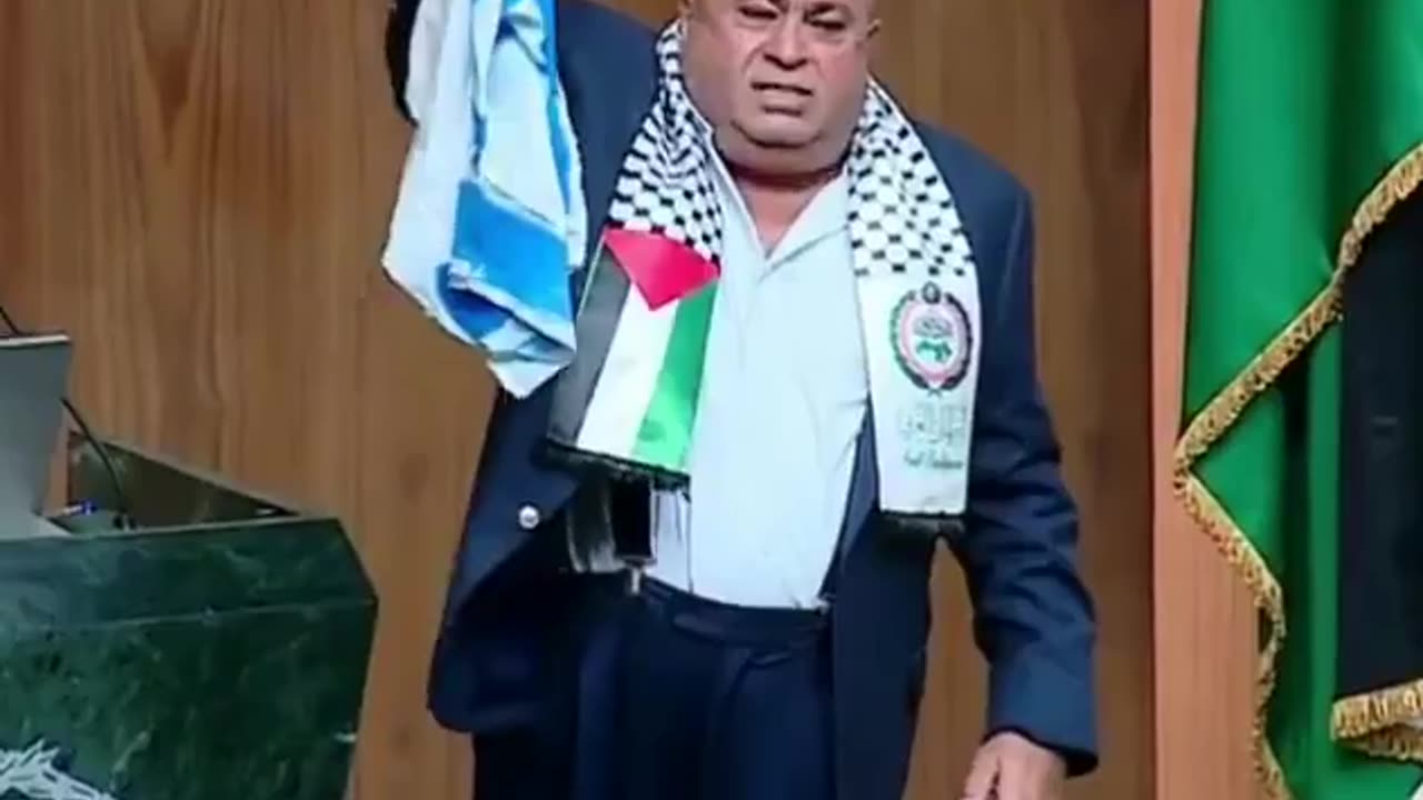 Jordanian MP burns the Israeli flag and stamps on it