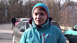 Fleeing war, people cross into Romania from Ukraine