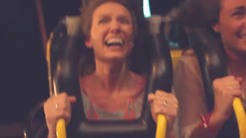 Two Women Having a Blast at Fun Fair