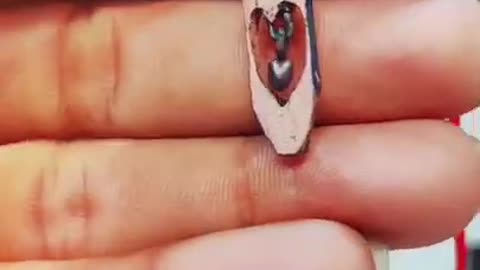 Guy Shows Off Sharp Pencil Carving Skills by Carving Pendant Out of Pencil