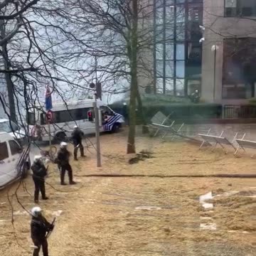 Farmers in Brussels tear down barricades erected by police