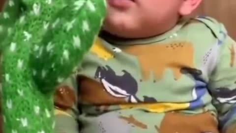 Cute babies playing with dancing cactus