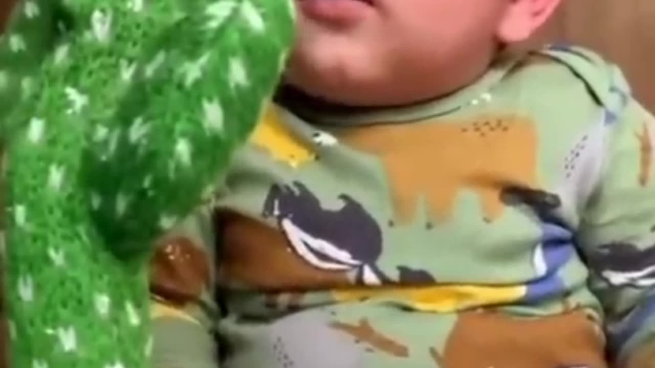 Cute babies playing with dancing cactus