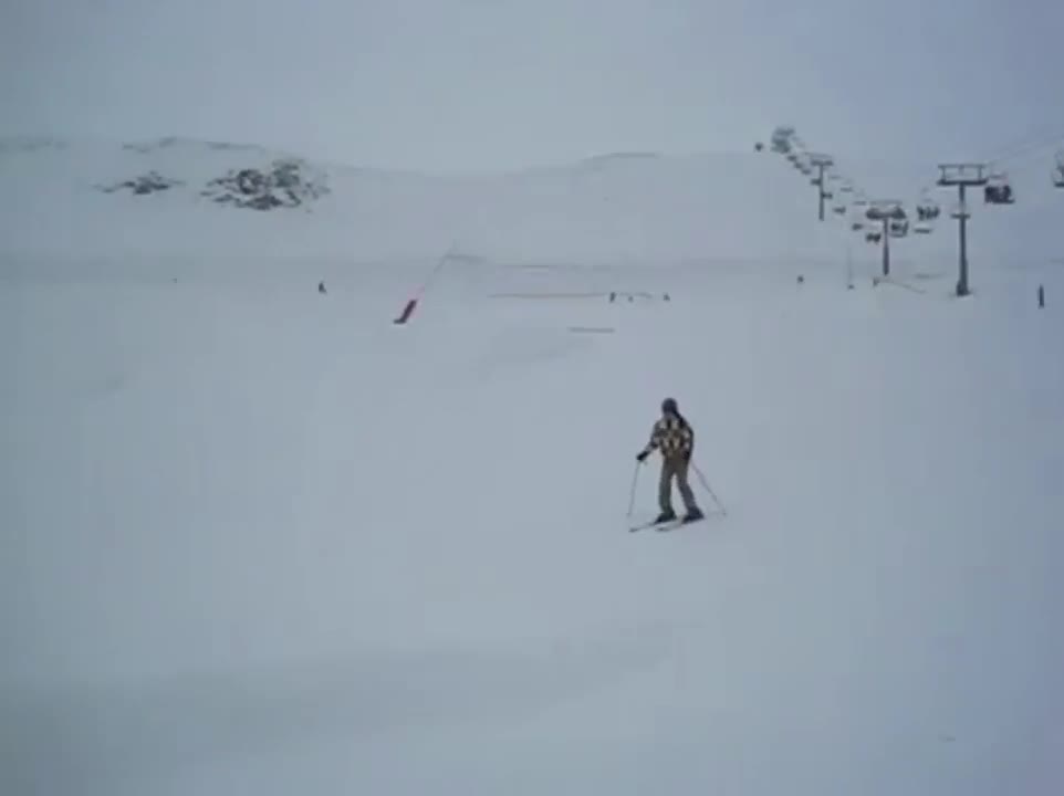 Skier Crashes Into Snow While Landing A Jump