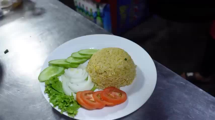 Add around a tablespoon of nasi goreng paste and a drizzle of soy sauce and stir through.