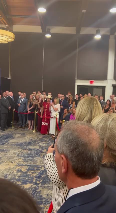 Trump talks to the crowd and a woman tells him that the whole room has been praying for him