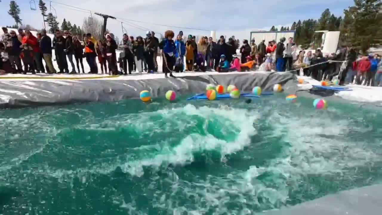 Skiier eats it trying to pond skim!