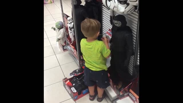 Kid kisses star wars toys goodbye