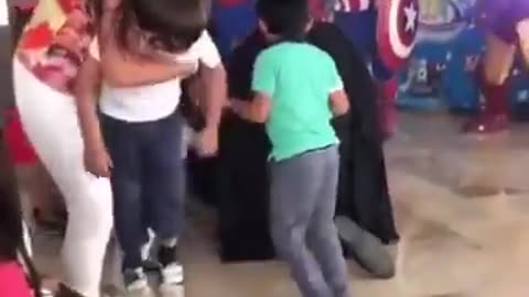Kid saves batman