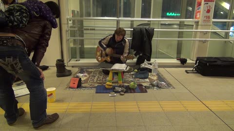 Busking and selling my CDs at Nagaoka Station near Niigata, Japan