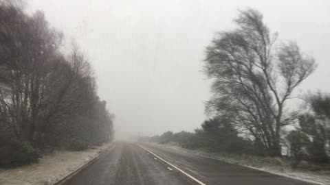 Snow while turning back from going to Forres due to a road closure.