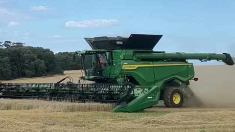 John Deere x9 harvesting Spring Barley