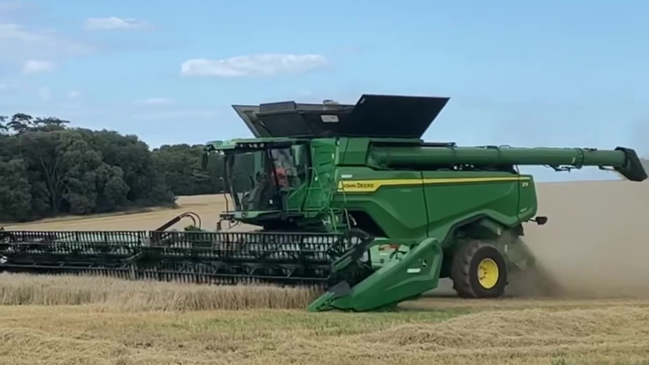 John Deere x9 harvesting Spring Barley