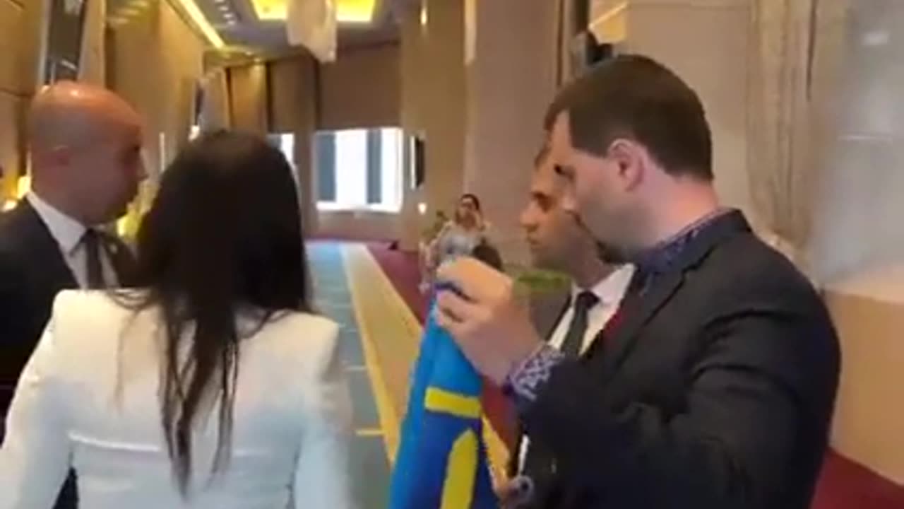 Russian Diplomat attempts to steal Ukrainian Flag at PABSEC