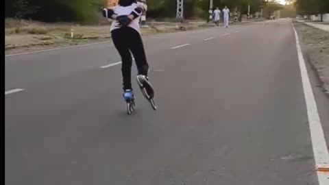 A little girl palying on the road