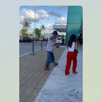 Maloka walks past people on the street and they react