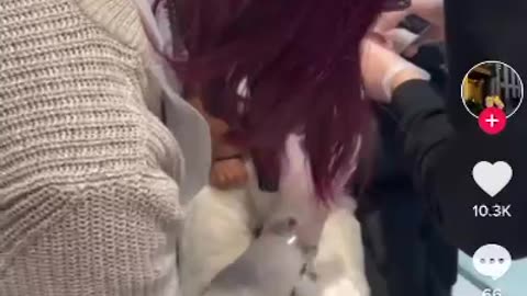 Baby being so calm while having her ear done