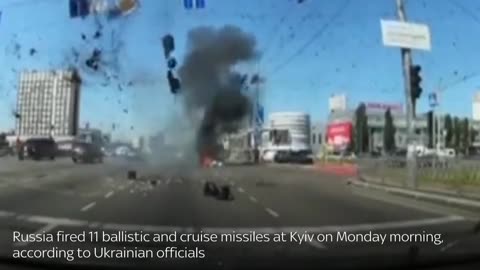 Ukraine War: Dashcam footage shows the moment rocket debris hits a busy road in Kyiv