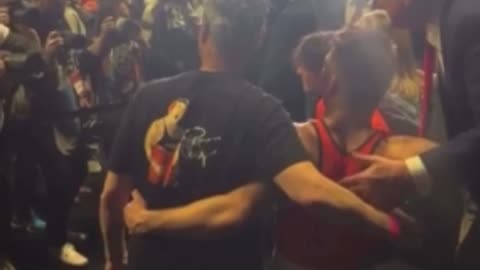 Wrestlers walk over to shake President Trump’s hand