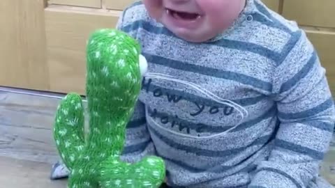 Cute Babies Playing with Dancing Cactus