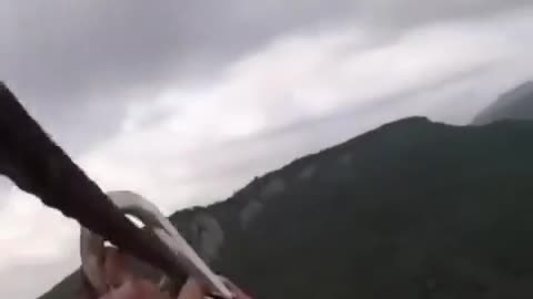 Man Ziplining with the wrong equipment.