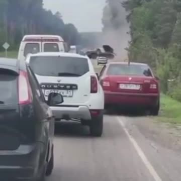 Belgorod commuters wait patiently as a BM-21 fires a salvo into Ukraine