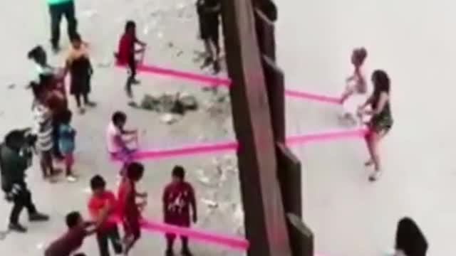 They installed seesaws to connect people on both sides of US #Me...