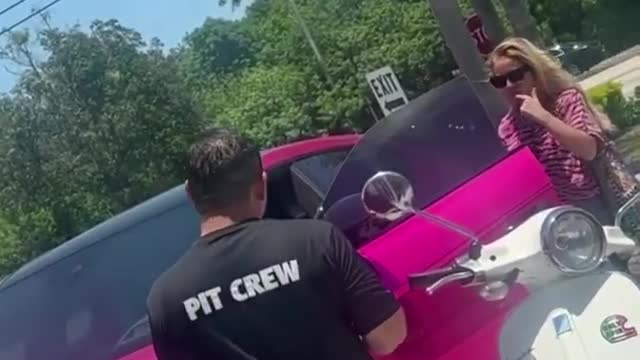 Fuming driver confronts stranger breaking into luxury sports car to pose for SELFIES