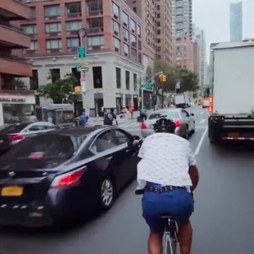 Dude bikes through traffic and finds out