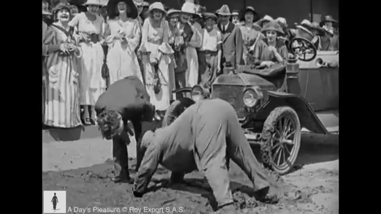 Charlie Chaplin trapped in tar - A Day's Pleasure (1919)