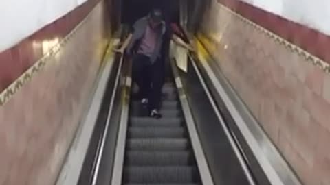 Man falls on escalator