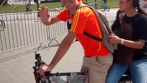 James riding Chinese girl on ebike