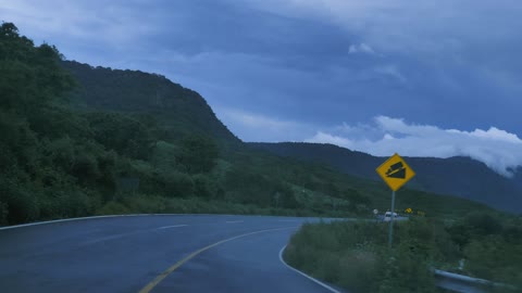 Going down a curved highway down a mountain