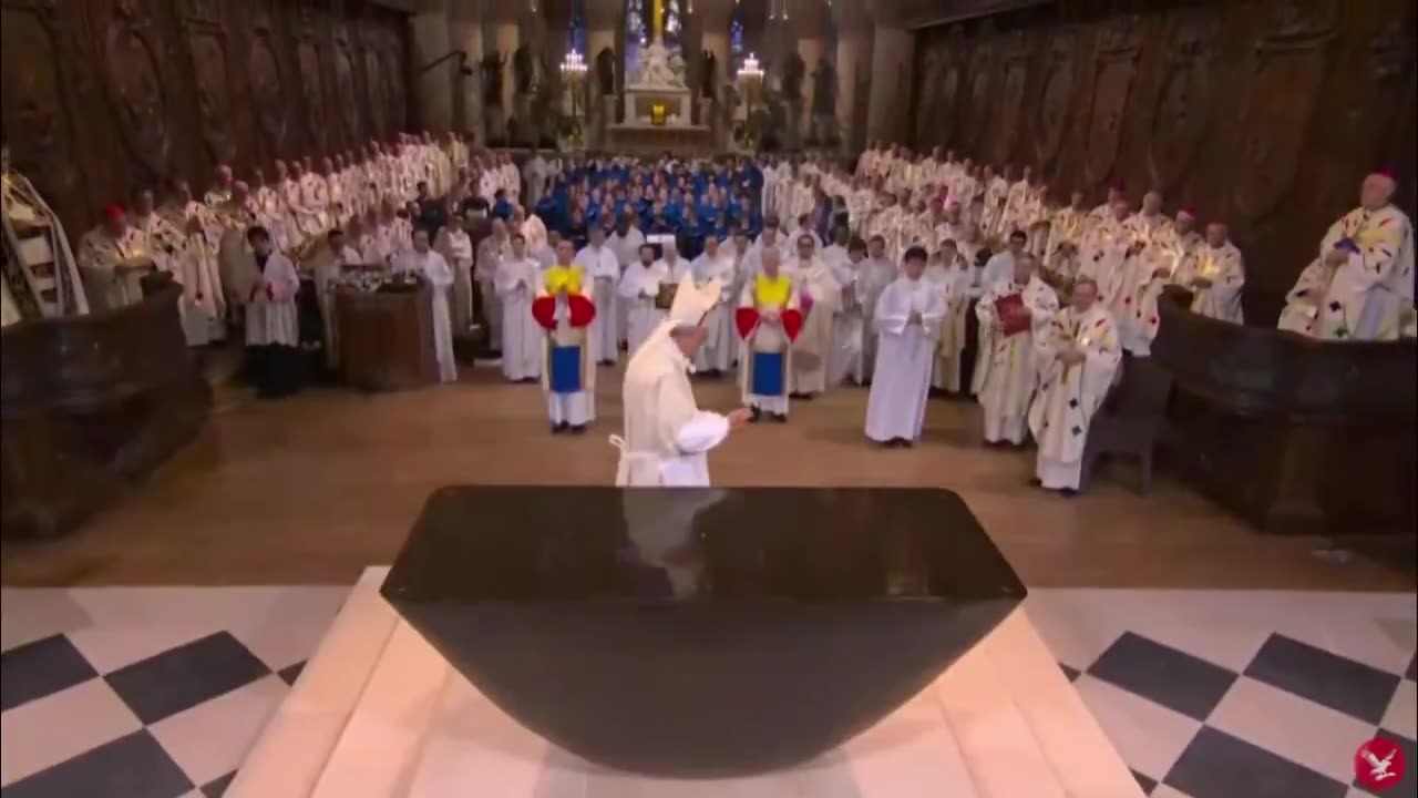 Roman Catholic priest consecrating the altar at the newly renovated Notre-Dame Cathedral