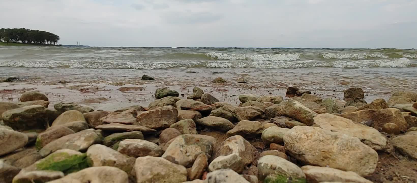 Relaxing rocky beach, water on rocks no crabs