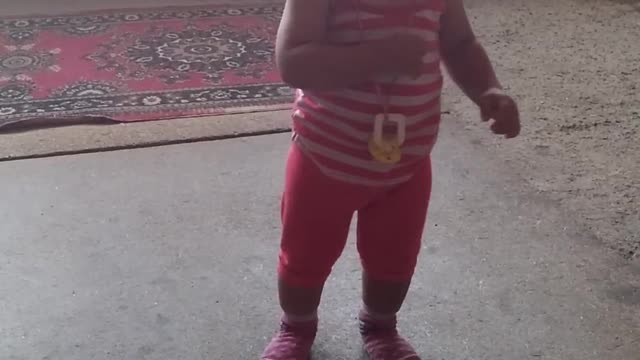 The little girl is just starting to walk.