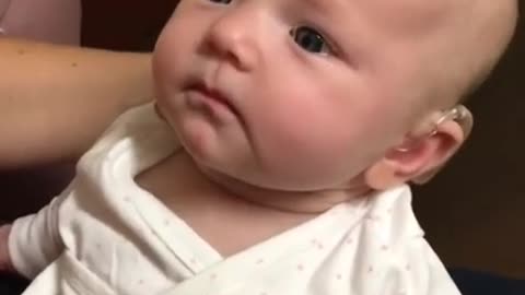 Baby hears for the first time and is almost moved to tears