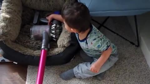 Young toddler discovers Vacuum !!!