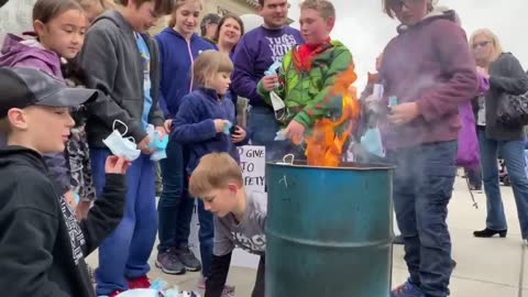 Children burning their masks