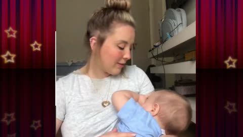 baby feeding milk ,mother sing a song