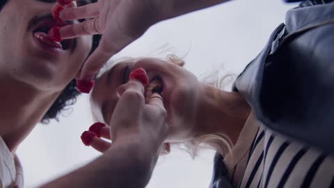 a-couple-eating-raspberries