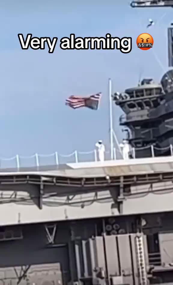 A US sailor saluted the Stars and Stripes which was hoisted incorrectly.