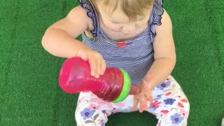 Cute toddler "washes" her hair with sweet tea!