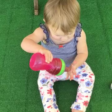 Cute toddler "washes" her hair with sweet tea!