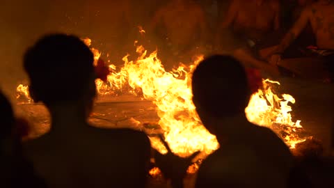 People gathered around the campfire